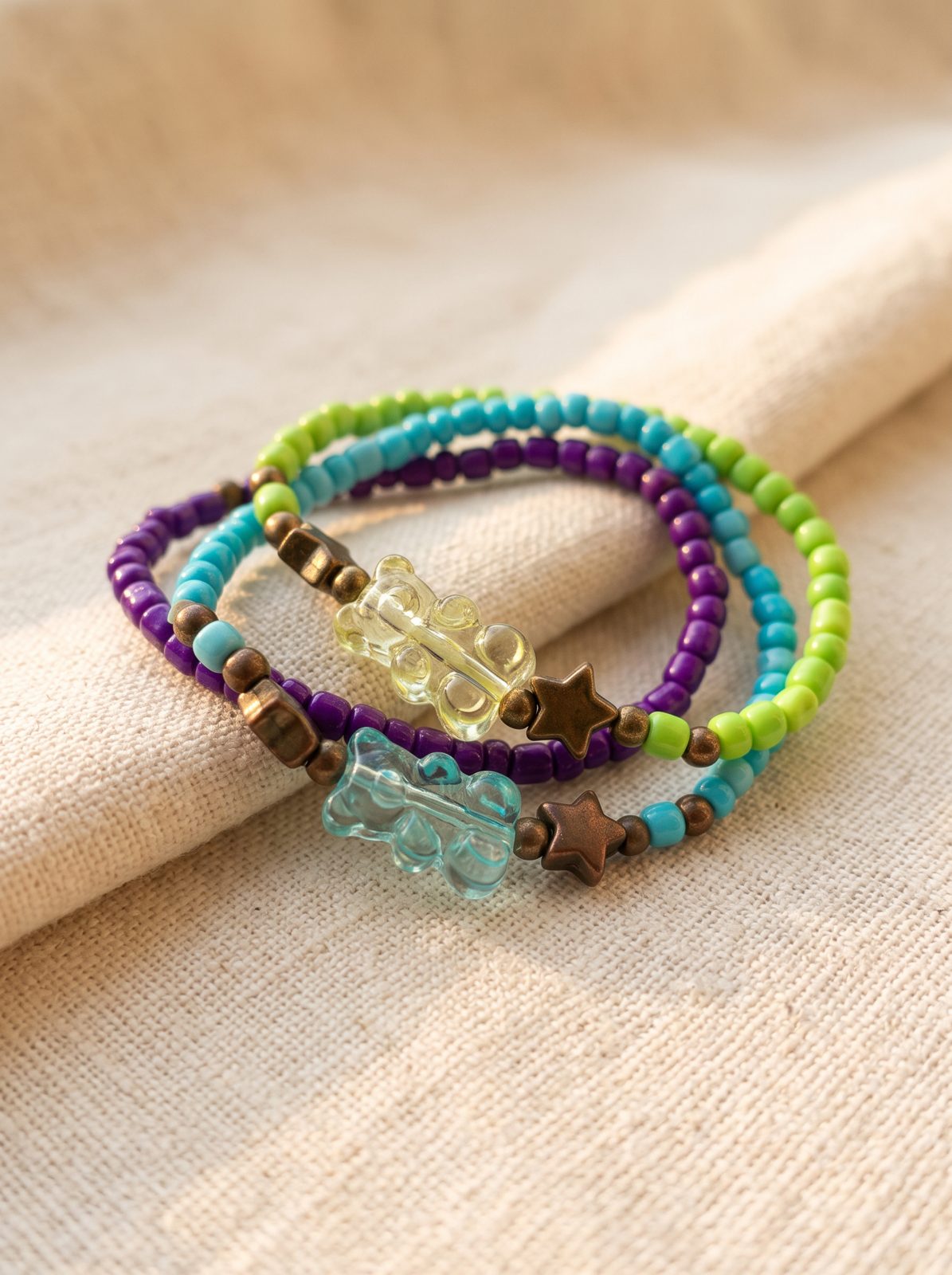 Beaded bracelets with star and bear charms